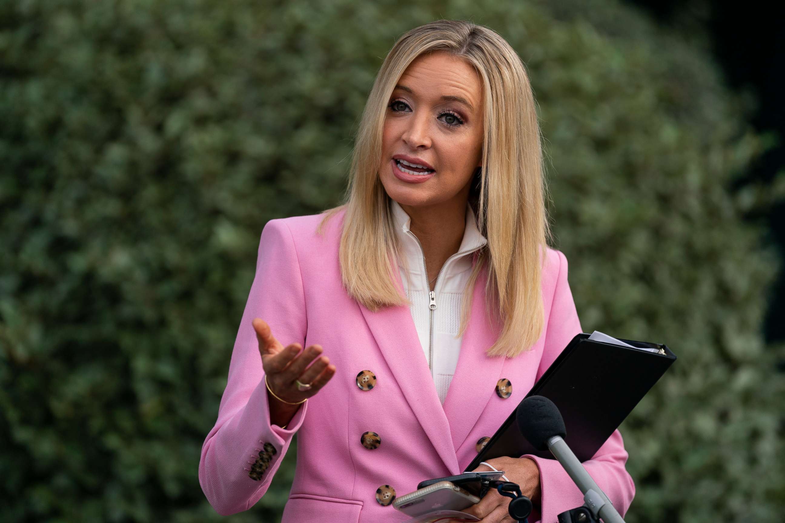 PHOTO: White House press secretary Kayleigh McEnany talks with reporters at the White House, May 19, 2020, in Washington.