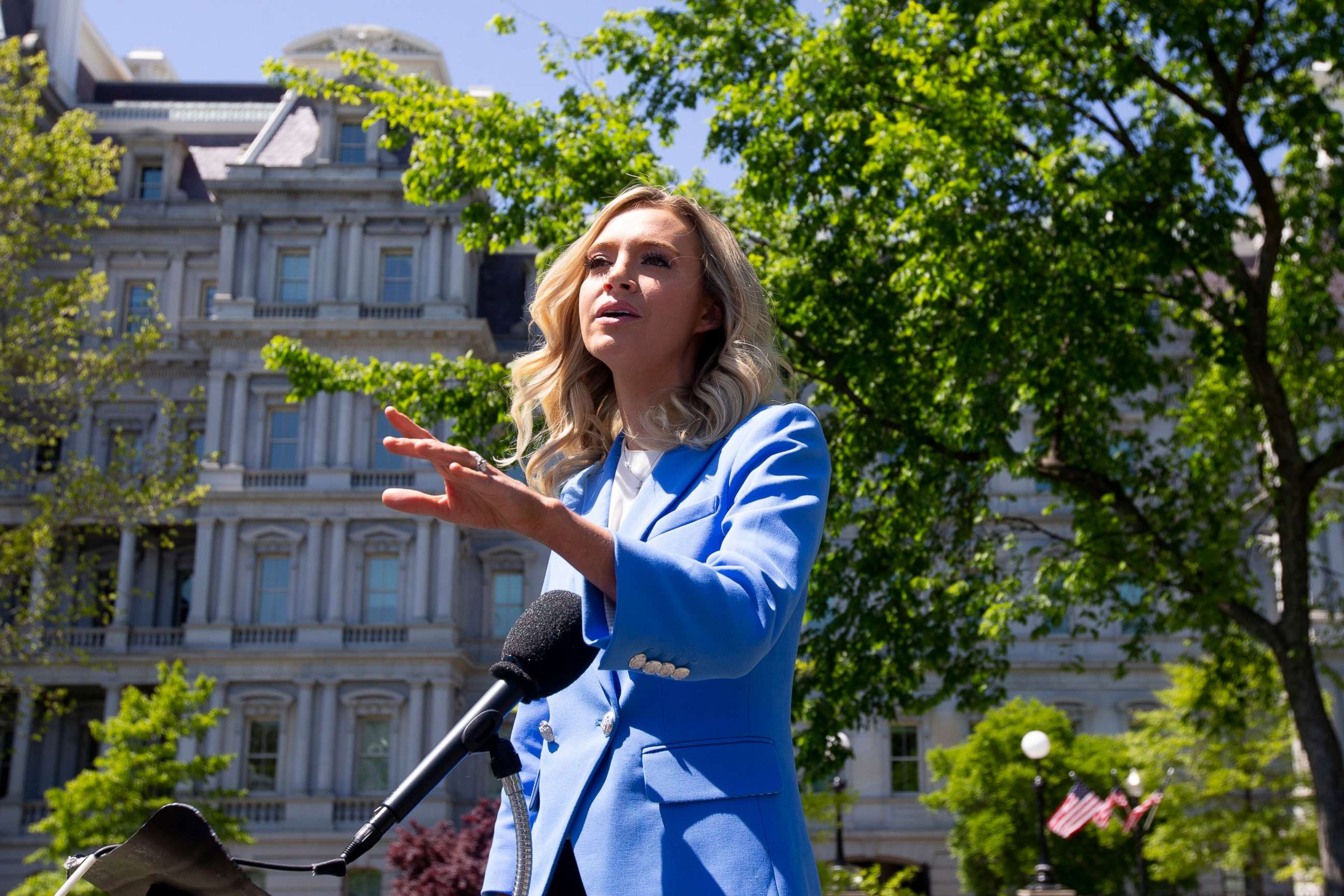 PHOTO: White House Press Secretary Kayleigh McEnany responds to questions from members of the news media outside the West Wing of the White House in Washington, April 22, 2020.
