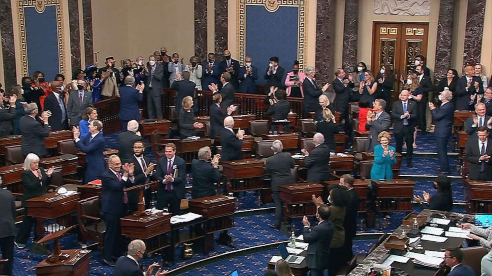 PHOTO: Senators and guests applaud following the vote to confirm Ketanji Brown Jackson to the Supreme Court on the Senate floor, April 7, 2022, in Washington, D.C.