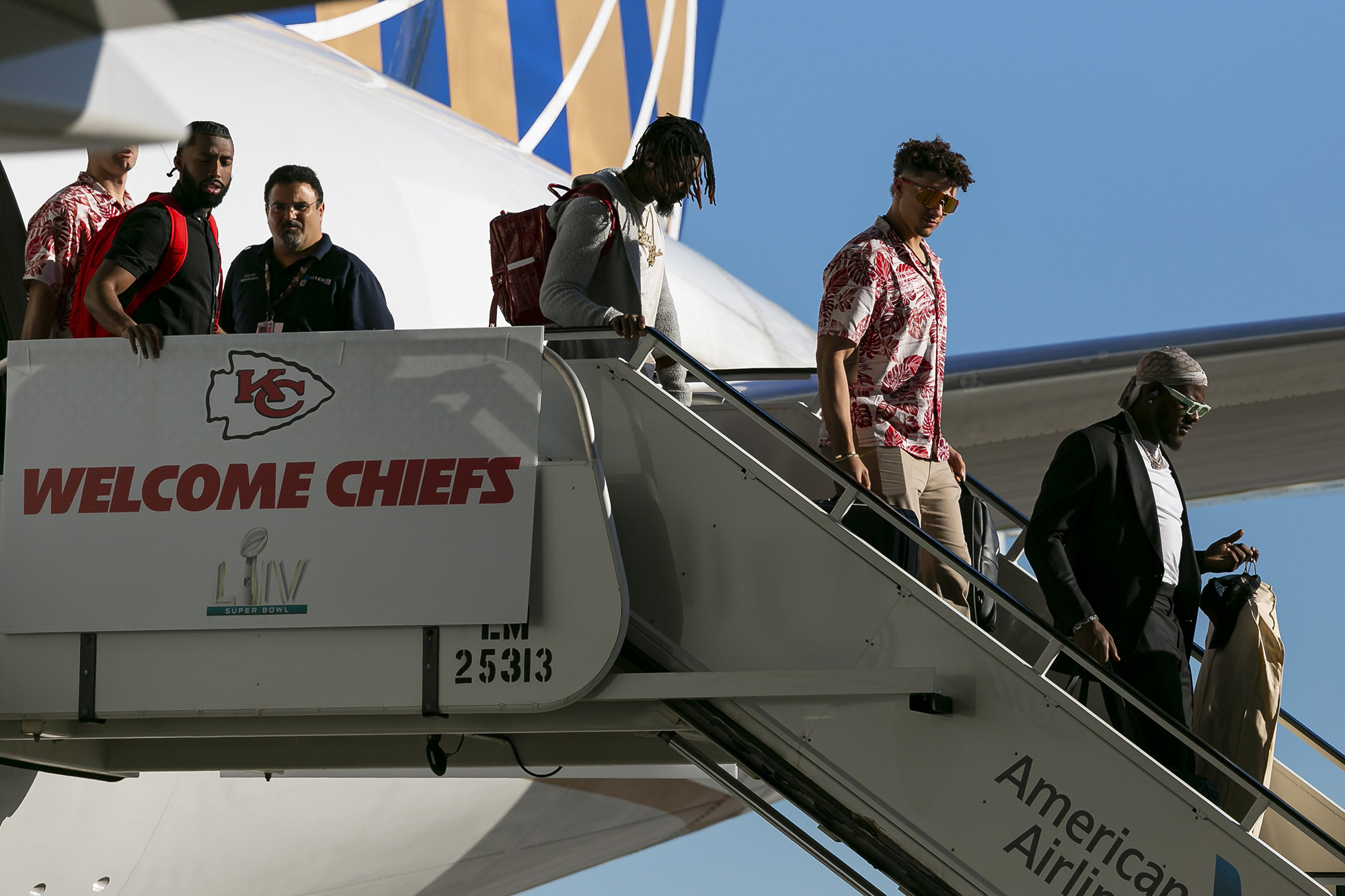 PHOTO: Kansas City Chiefs quarterback Patrick Mahomes (15) arrives alongside teammates and coaches at Miami International Airport in Miami, Jan. 26, 2020. 