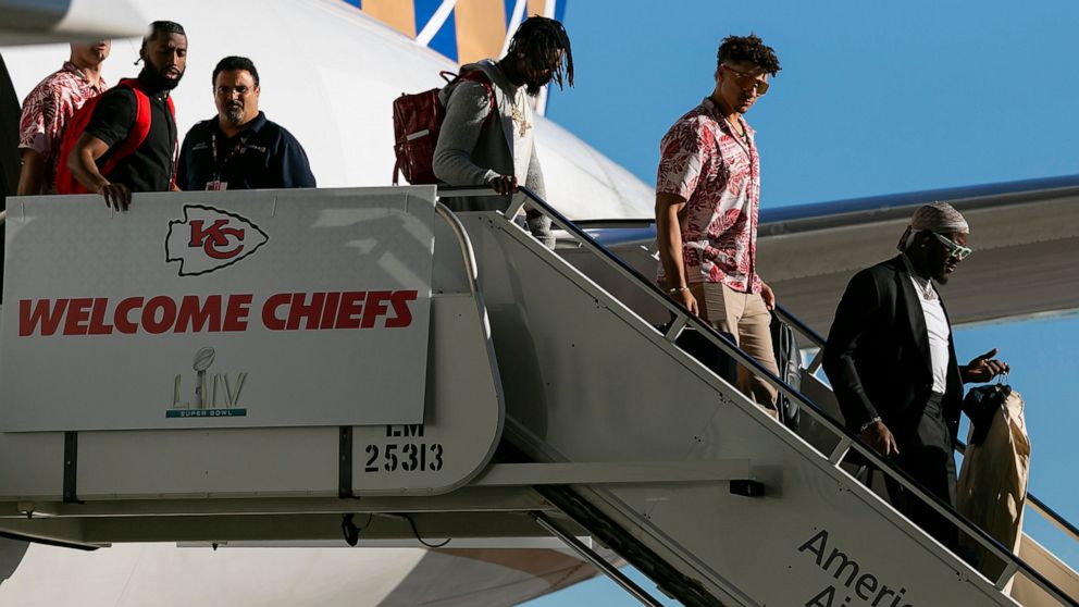 PHOTO: Kansas City Chiefs quarterback Patrick Mahomes (15) arrives alongside teammates and coaches at Miami International Airport in Miami, Jan. 26, 2020.