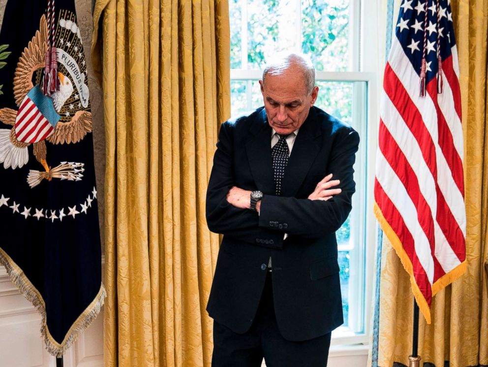 PHOTO: White House Chief of Staff John Kelly waits while Governor of Puerto Rico Ricardo Rossello and President Donald Trump make statement to the press before a meeting in the Oval Office of the White House, Oct. 19, 2017.