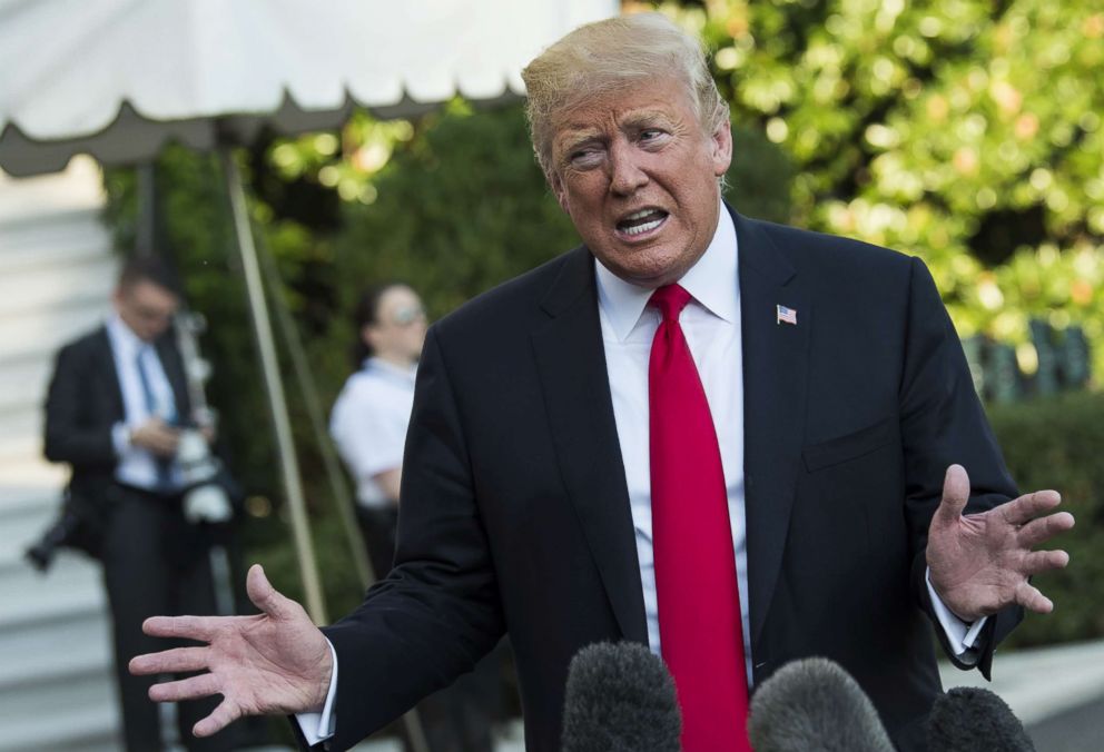 PHOTO: President Donald Trump talks to the press as leaves the White House on the South Lawn prior to boarding Marine One en route to Wheeling, W.Va., Sept. 29, 2018, in Washington.