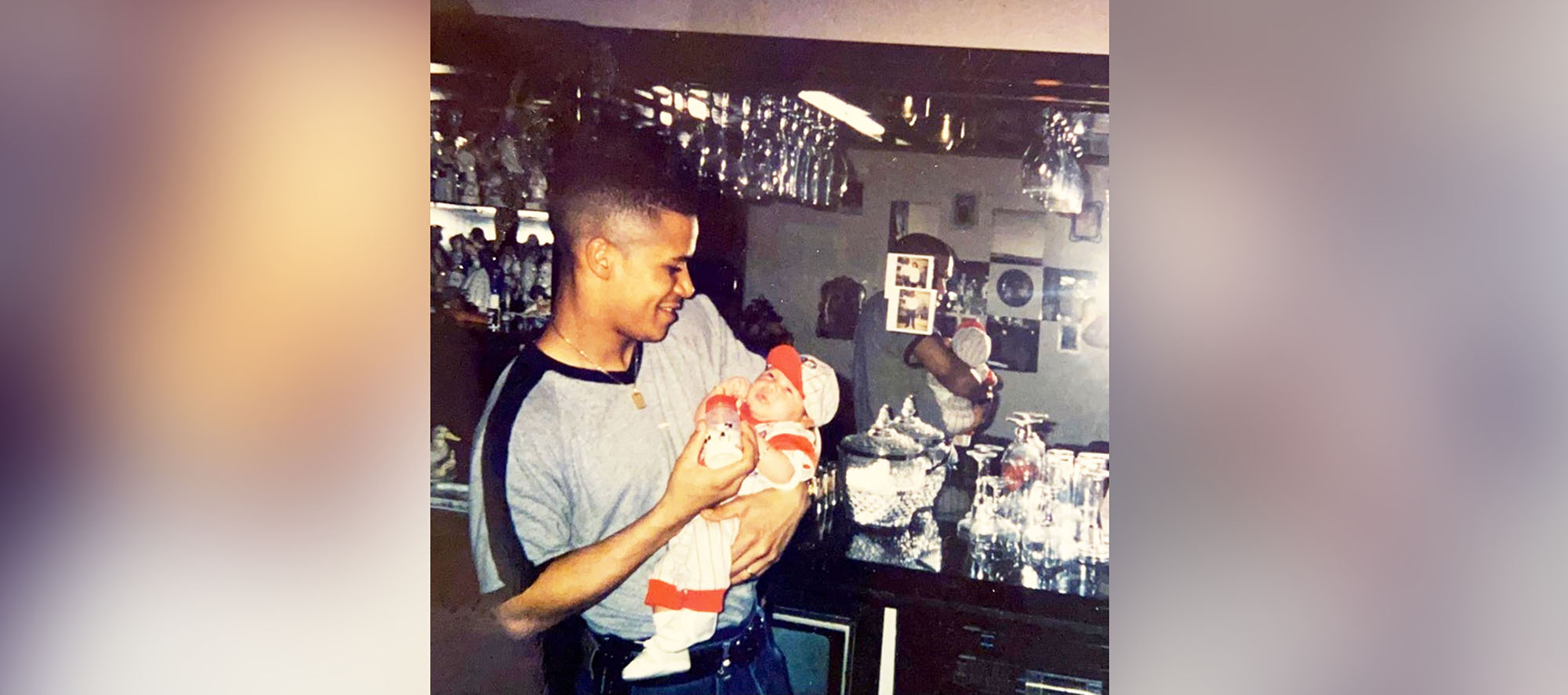 PHOTO: Kelvin Silva holds his son, Kelvin Jr. Silva came to the United States in 1988, where he joined his father who was a naturalized United States citizen.