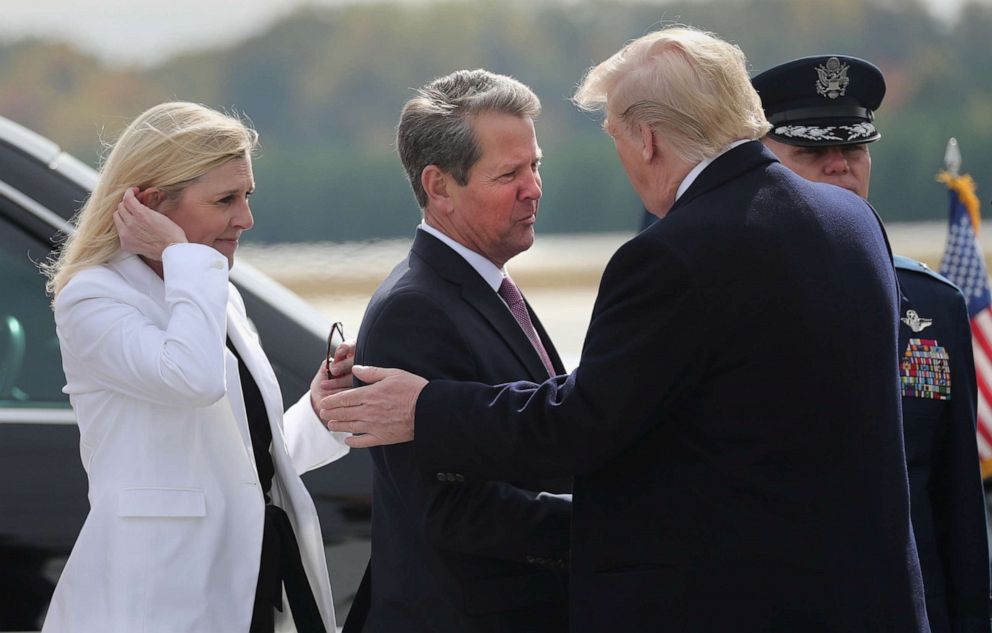 PHOTO: President Donald Trump is greeted by Georgia Governor Brian Kemp and his wife Marty upon his arrival in Marietta, Ga., U.S. Nov. 8, 2019.
