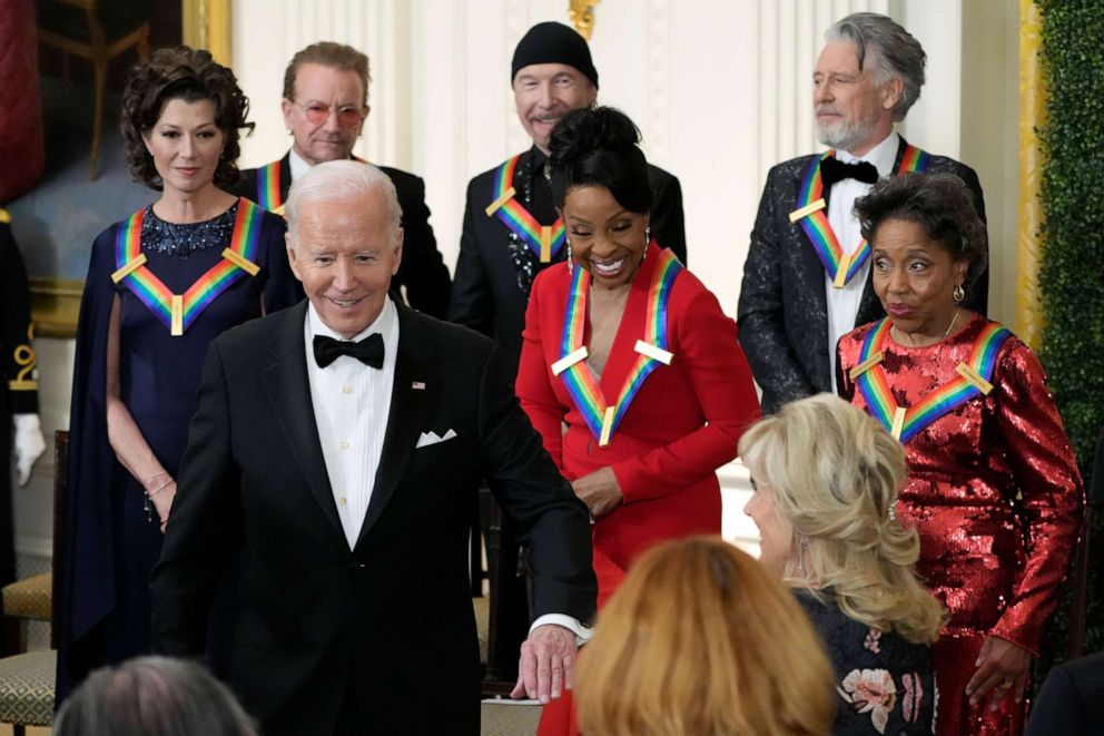 PHOTO: President Joe Biden holds out his arm for first lady Jill Biden as they leave the Kennedy Center honorees reception at the White House, Dec. 4, 2022, in Washington.