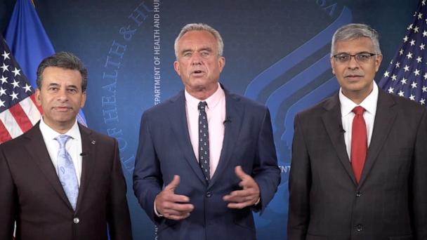 Health and Human Services Secretary Robert F. Kennedy Jr., standing next to Food and Drug Administration Commissioner Marty Makary and National Institutes of Health Director Jay Bhattacharya, seen in a post on X where he announced the removal of the COVID-19 vaccine from the Centers for Disease Control and Prevention's immunization schedule for healthy children and pregnant women.