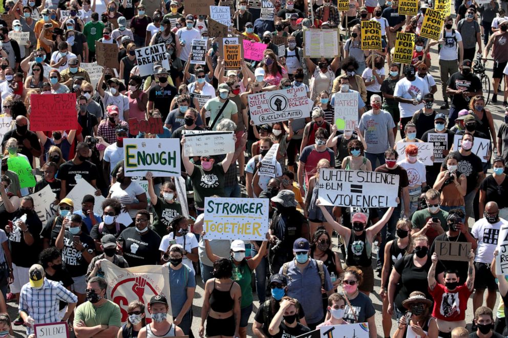 PHOTO: People march in support of Jacob Blake and his family to the Kenosha County Courthouse on Aug. 29, 2020, in Kenosha, Wis.