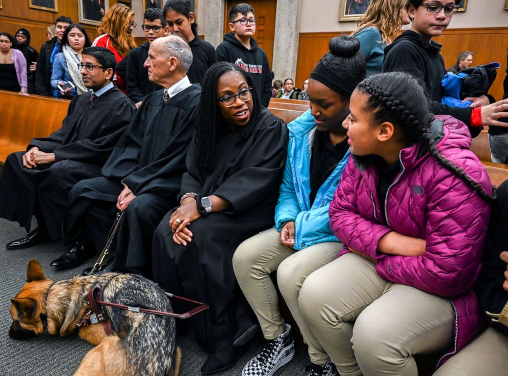 PHOTO: Judge Ketanji Brown Jackson, center, talks with local high school students who have come to observe a reenactment of a landmark Supreme court case at U.S. Court of Appeals in Washington, DC.
