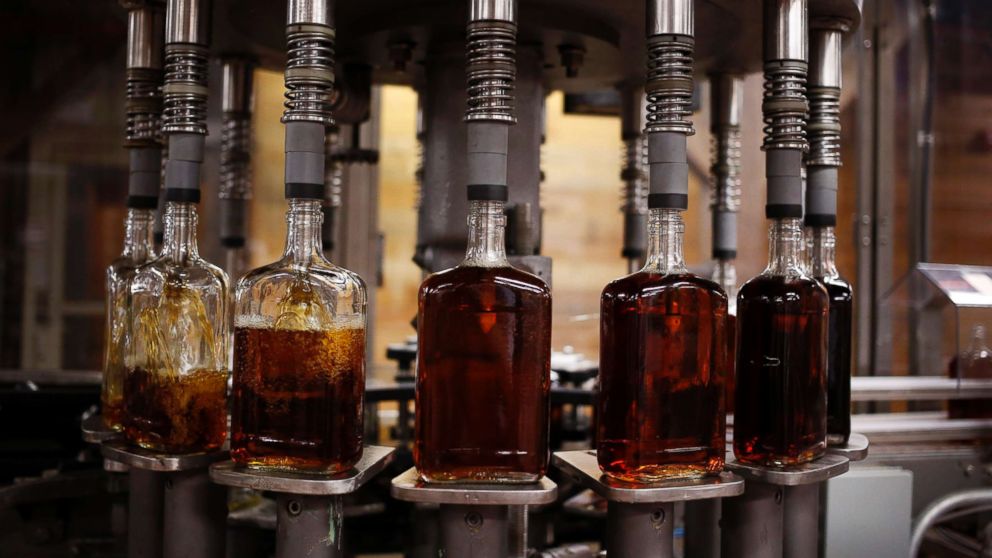 PHOTO: Bottles of Knob Creek single barrel bourbon are filled on the bottling line at the Beam Inc. distillery in Clermont, Ky., Aug. 1, 2013.