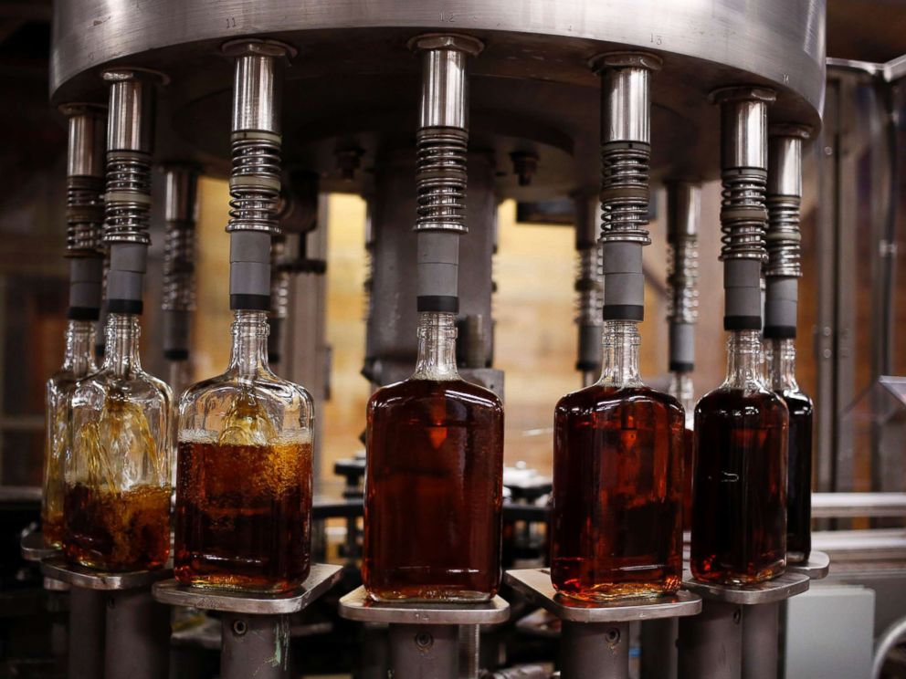PHOTO: Bottles of Knob Creek single barrel bourbon are filled on the bottling line at the Beam Inc. distillery in Clermont, Ky., Aug. 1, 2013.