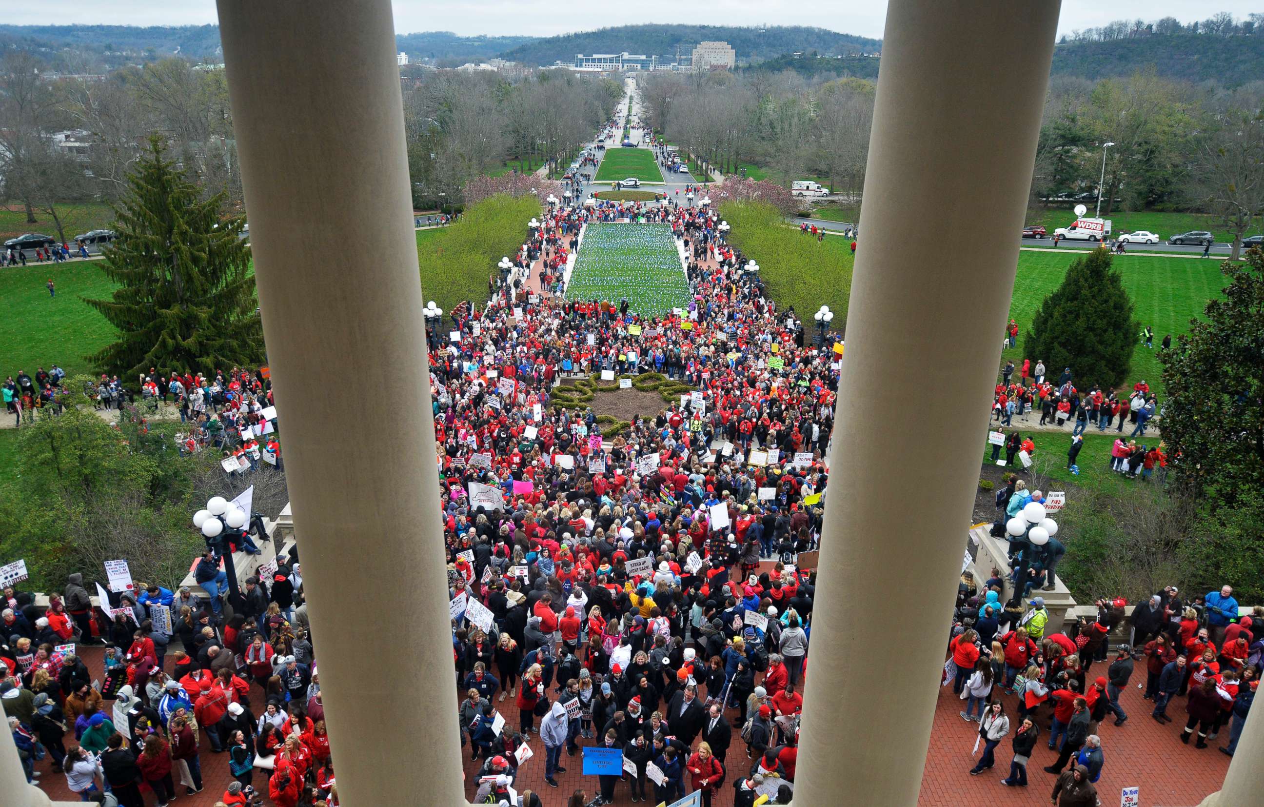 PHOTO: Teachers from across Kentucky gather outside the state Capitol to rally for increased funding and to protest changes to their state funded pension system, April 2, 2018, in Frankfort, Ky.