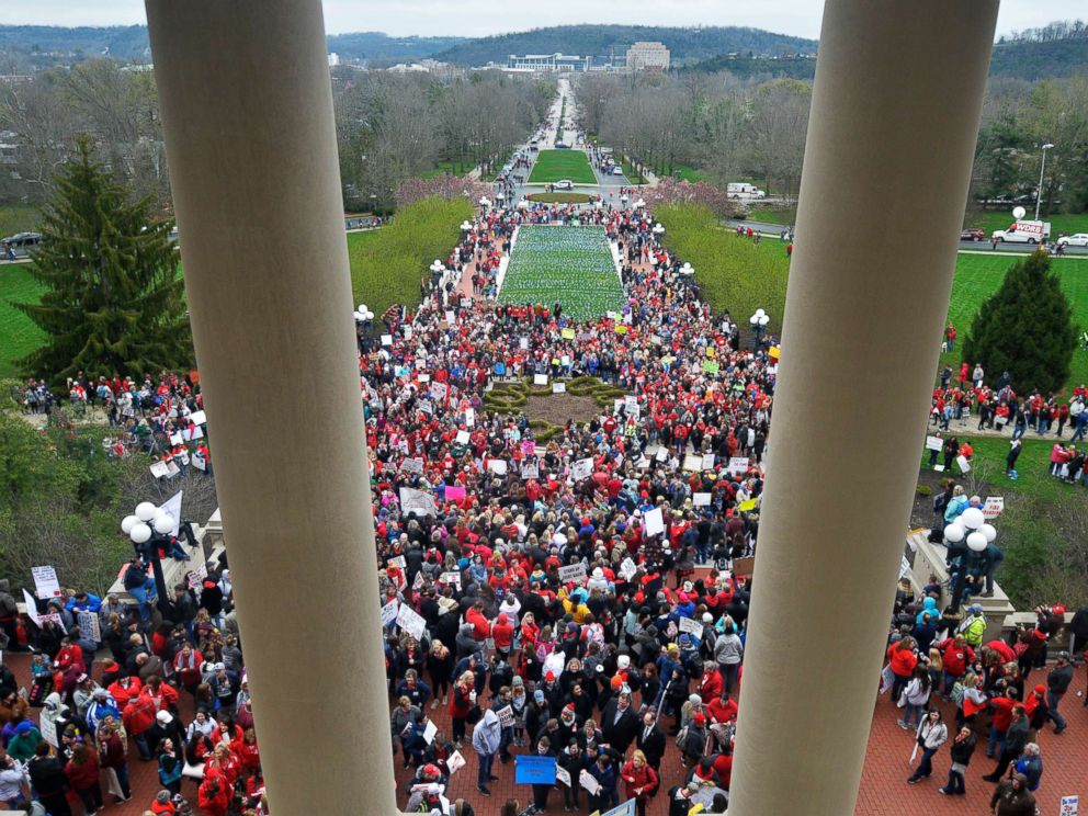 PHOTO: Teachers from across Kentucky gather outside the state Capitol to rally for increased funding and to protest changes to their state funded pension system, April 2, 2018, in Frankfort, Ky.