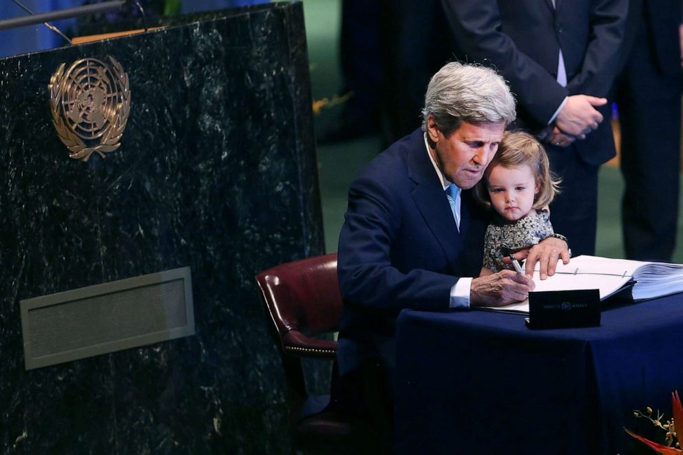 PHOTO: U.S. Secretary of State John Kerry holds his two year-old granddaughter Isabel Dobbs-Higginson for the Signing Ceremony for the Paris Agreement climate change accord at the United Nations, April 22, 2016, in New York City.