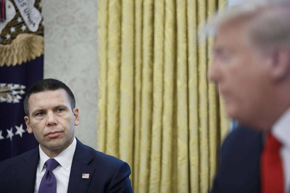 PHOTO: Kevin McAleenan, acting secretary of the Department of Homeland Security (DHS), left, listens while President Donald Trump speaks to members of the media in the Oval Office of the White House in Washington, D.C., on Sept. 4, 2019.
