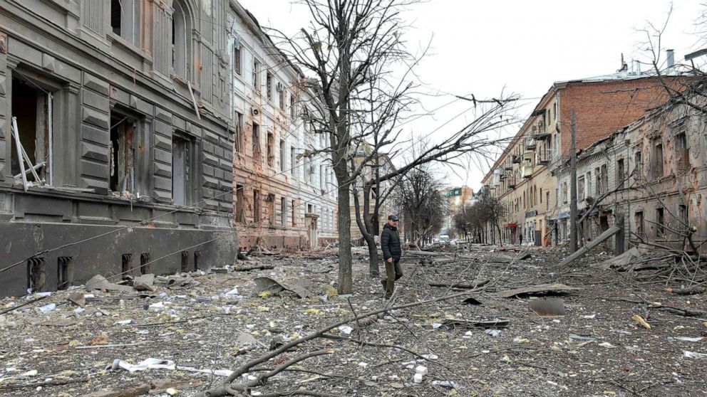 PHOTO: A pedestrian walks amid debris in a street following a shelling in Ukraine's second-biggest city of Kharkiv, March 7, 2022. 