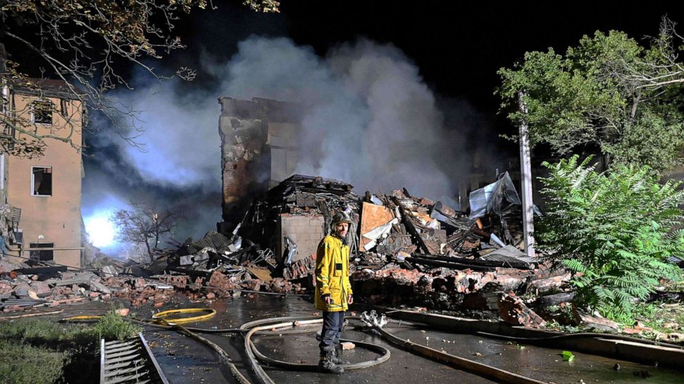 PHOTO: A firefighter stands in front of a destroyed hostel, after a missile strike hit the city Kharkiv, Ukraine, Aug. 17, 2022.