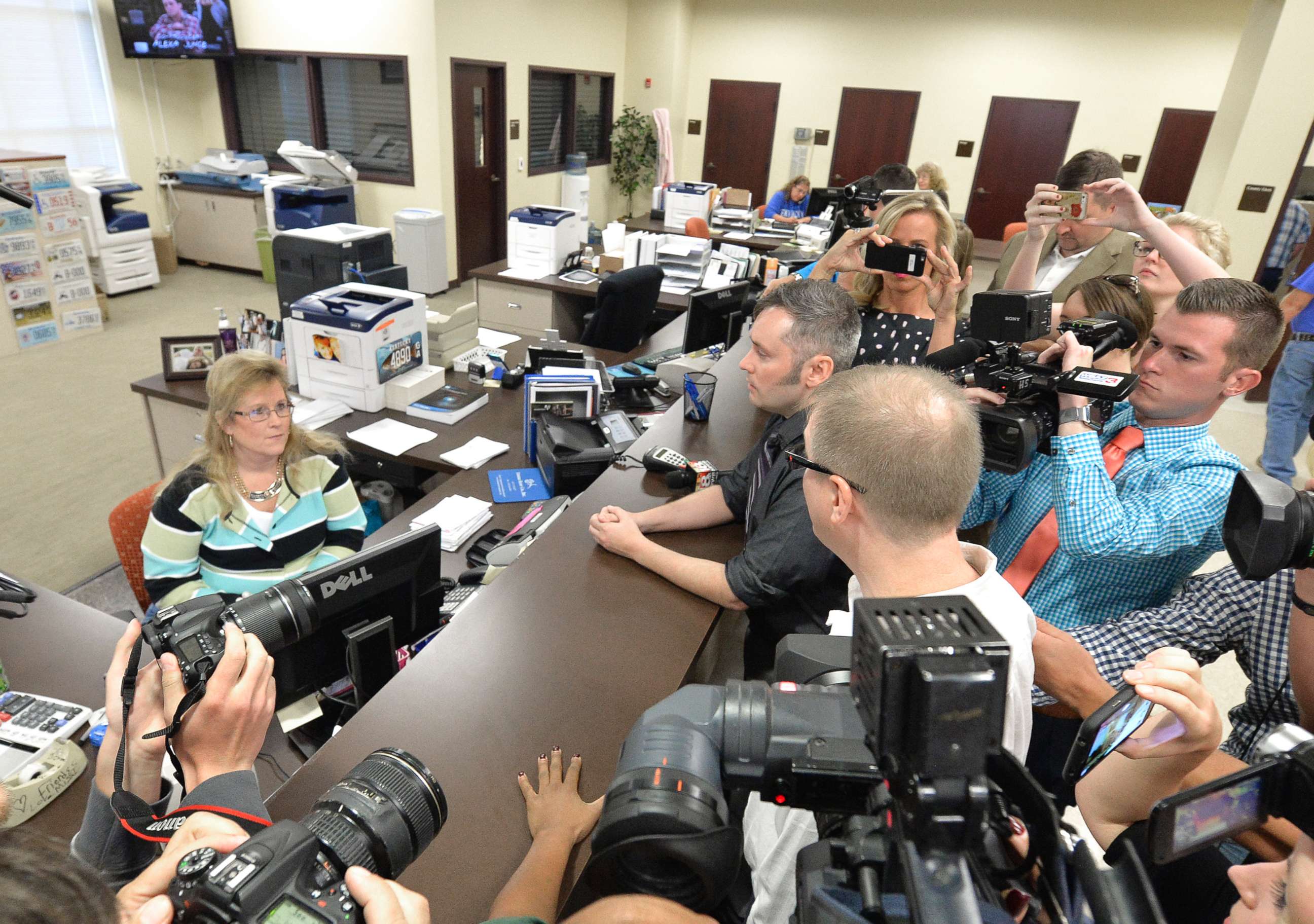 PHOTO: David Moore, center, and his partner David Ermold attempt to apply for a marriage license at the Rowan County Courthouse in Morehead, Ky., Sept. 1, 2015.