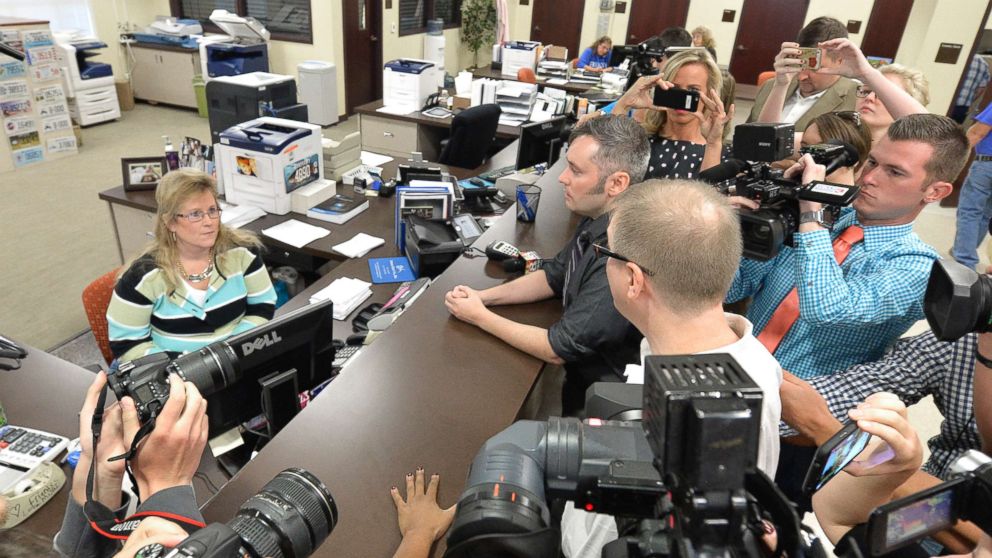 PHOTO: David Moore, center, and his partner David Ermold attempt to apply for a marriage license at the Rowan County Courthouse in Morehead, Ky., Sept. 1, 2015.
