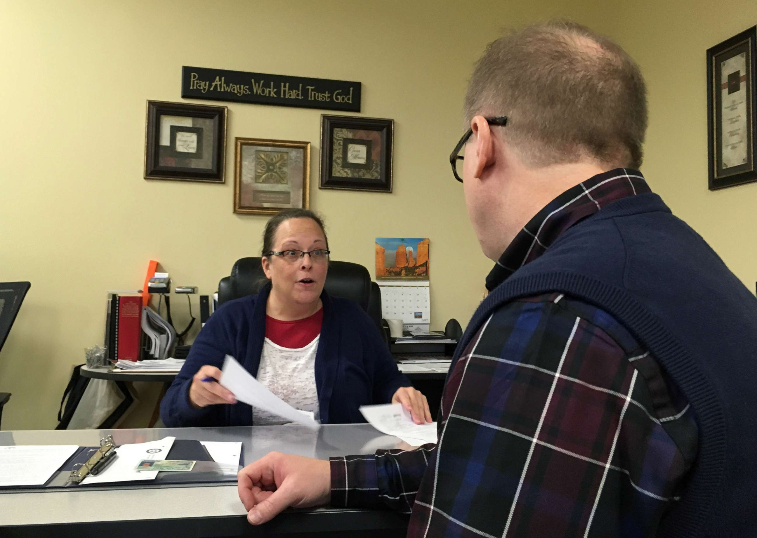 PHOTO: David Ermold speaks with Clerk Kim Davis as he files to run for Rowan County Clerk Wednesday, Dec. 6, 2017, in Morehead, Ky.