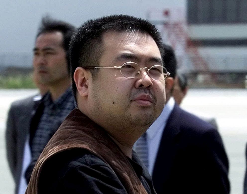 PHOTO: A man believed to be Kim Jong Nam, the eldest son of then North Korean leader Kim Jong Il, looks at a battery of photographers as he exits a police van to board a plane to Beijing at Narita international airport in Narita, Japan, May 4, 2001.