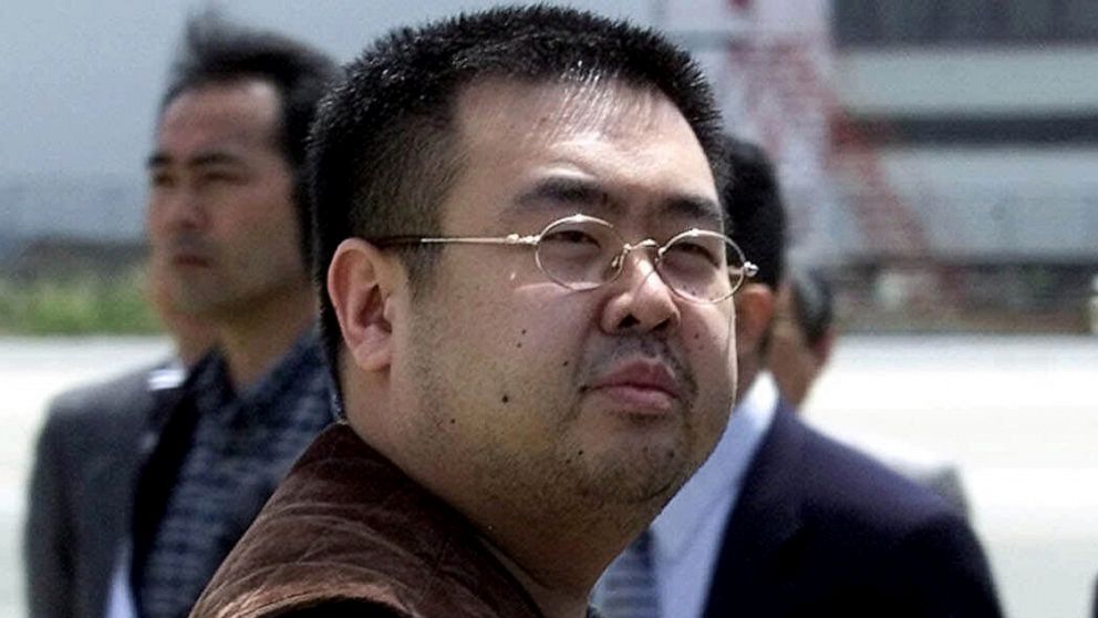 PHOTO: A man believed to be Kim Jong Nam, the eldest son of then North Korean leader Kim Jong Il, looks at a battery of photographers as he exits a police van to board a plane to Beijing at Narita international airport in Narita, Japan, May 4, 2001.