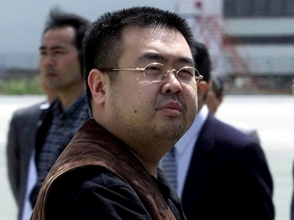 PHOTO: A man believed to be Kim Jong Nam, the eldest son of then North Korean leader Kim Jong Il, looks at a battery of photographers as he exits a police van to board a plane to Beijing at Narita international airport in Narita, Japan, May 4, 2001.