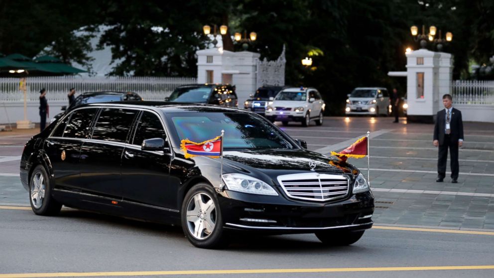 The car with flags flying carrying North Korean leader Kim Jong-un leaves Istana Presidential Palace after a meeting with Singapore Prime Minister Lee Hsien Loong in Singapore, June 10, 2018.