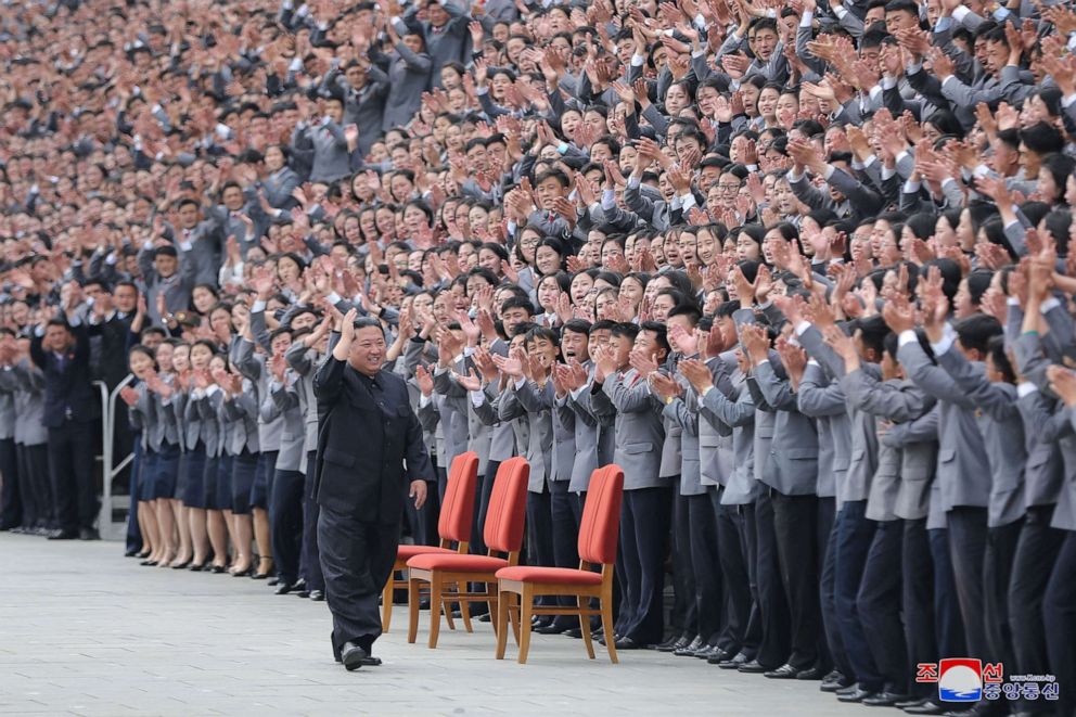 PHOTO: North Korean leader Kim Jong Un waves toward students and young workers during a photo session in Pyongyang, North Korea, May 1, 2022, in this photo released by North Korea's Korean Central News Agency.