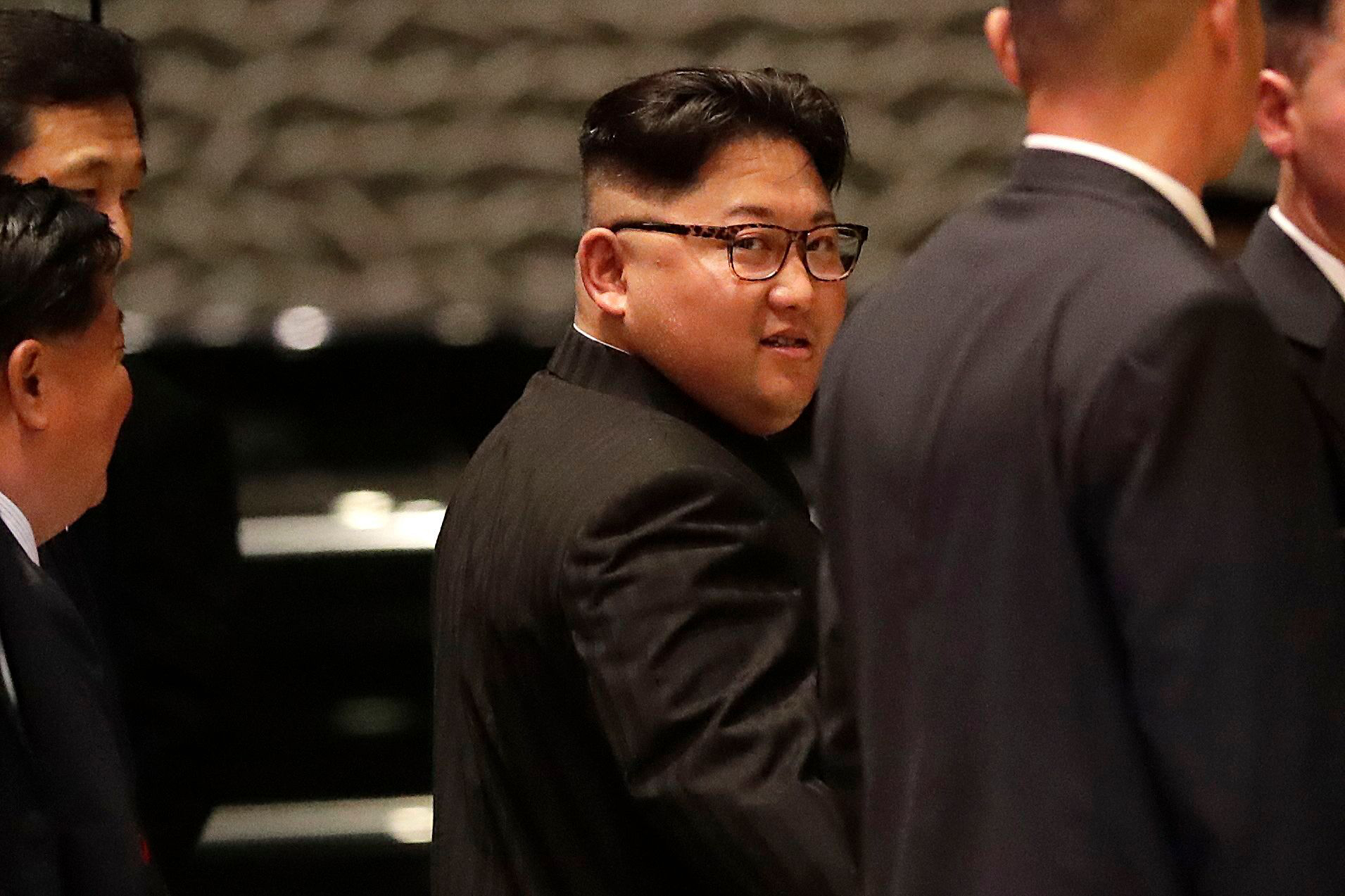 PHOTO: North Korean leader Kim Jong Un walks out from the Marina Bay Sands hotel during a city tour in Singapore, June 11, 2018.