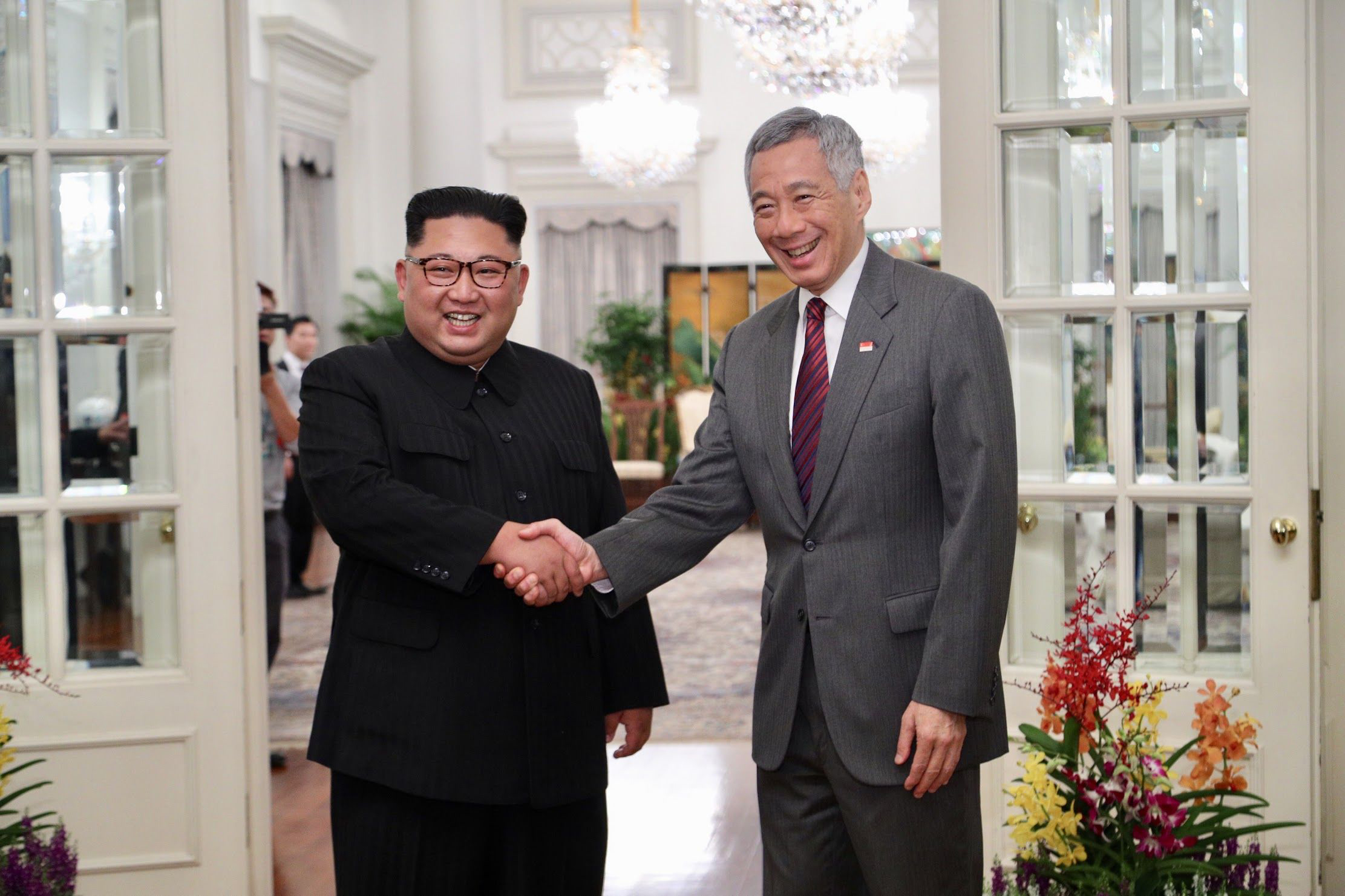 PHOTO: North Korean leader Kim Jong-un (L) and Singapore Prime Minister Lee Hsien Loong (R) shake hands during their meeting at the Istana Presidential Palace in Singapore, June 10, 2018.