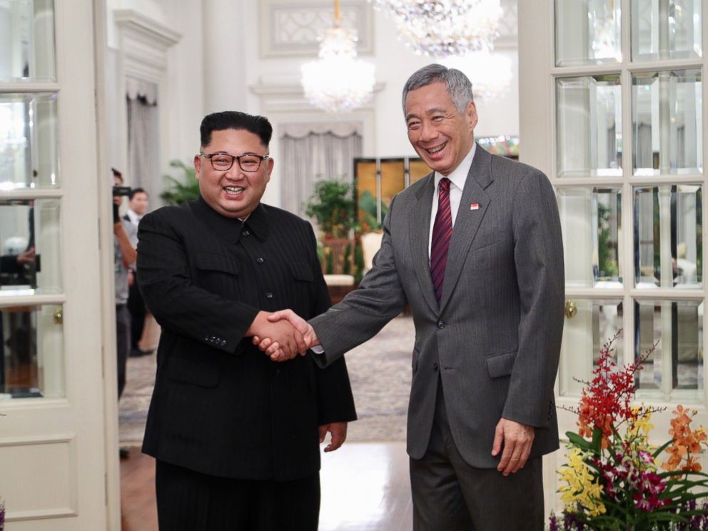 PHOTO: North Korean leader Kim Jong-un (L) and Singapore Prime Minister Lee Hsien Loong (R) shake hands during their meeting at the Istana Presidential Palace in Singapore, June 10, 2018.