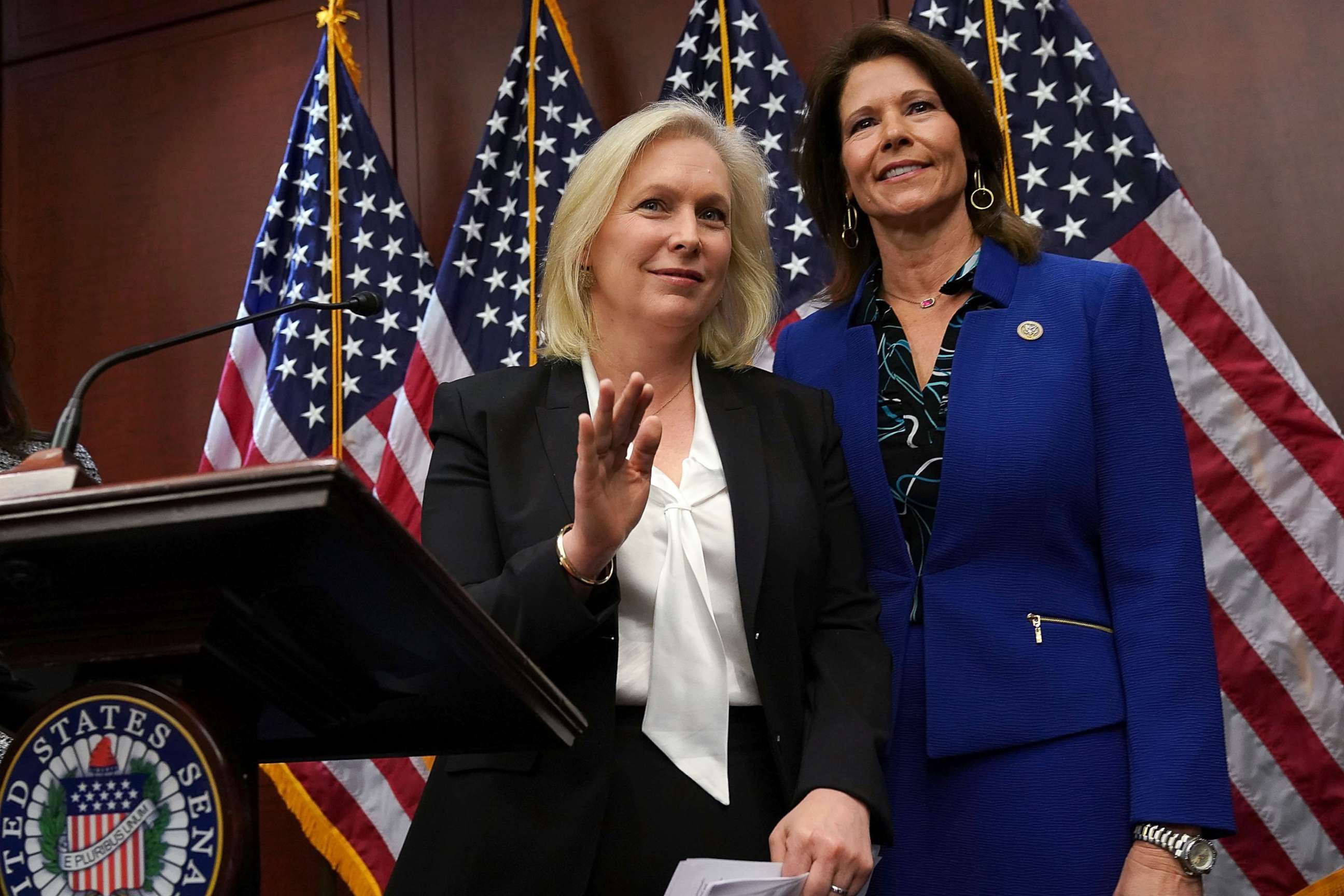 PHOTO: Sen. Kirsten Gillibrand, left, speaks, as Rep. Cheri Bustos listens, during a news conference, Dec. 6, 2017, on Capitol Hill in Washington.