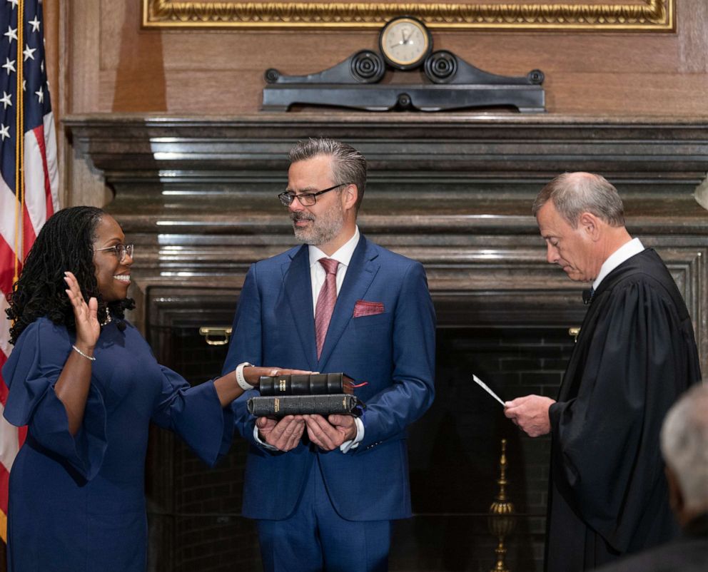 PHOTO: Chief Justice John G. Roberts, Jr. (R) administers the Constitutional Oath to Judge Ketanji Brown Jackson (L) in the West Conference Room of the Supreme Court, June 30, 2022, in Washington, D.C.