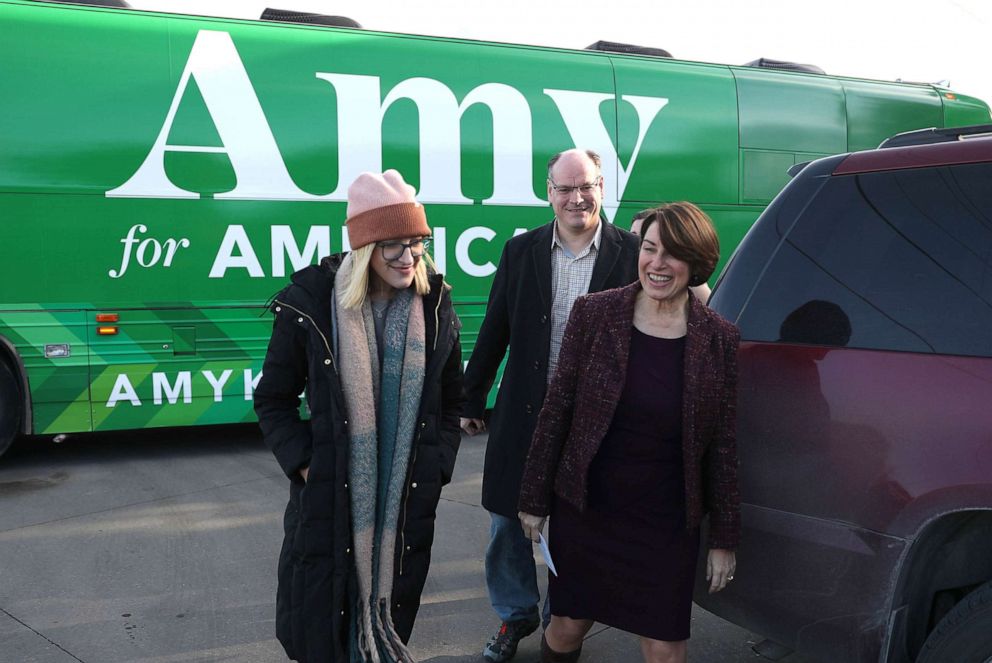 PHOTO: Democratic presidential candidate Sen. Amy Klobuchar (D-MN) arrives with husband John Bessler and daughter Abigail Bessler for a campaign stop, Dec. 27, 2019 in Humboldt, Iowa. 