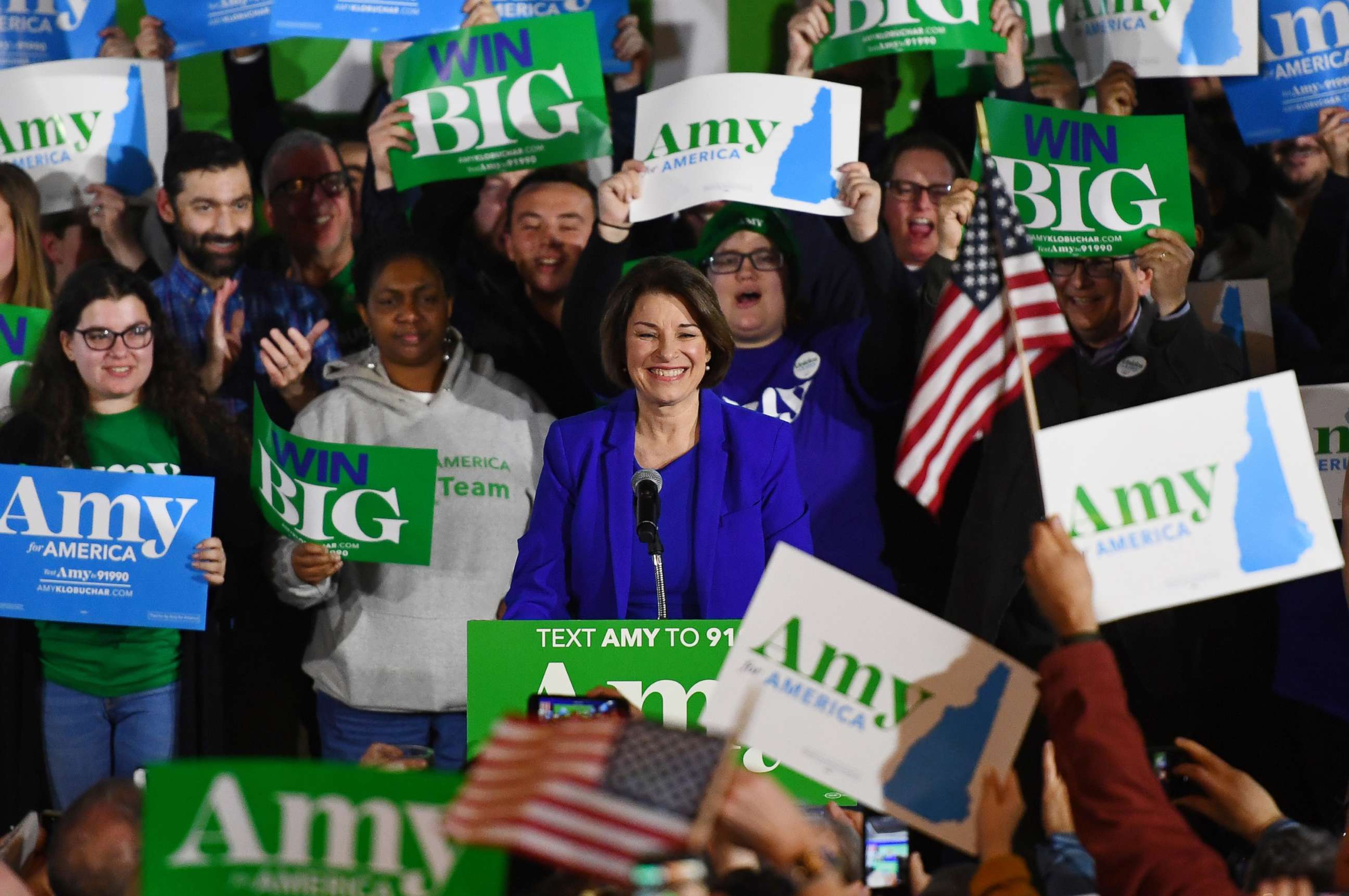 PHOTO: Supporters hold signs for U.S. Democratic presidential candidate Senator Amy Klobuchar at her New Hampshire primary night rally in Concord, N.H., Feb. 11, 2020. 