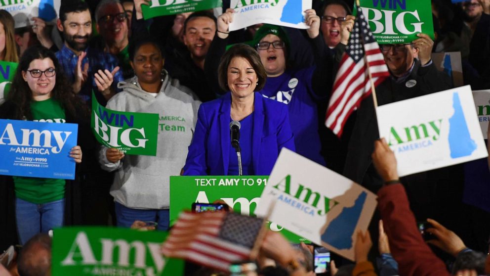 PHOTO: Supporters hold signs for U.S. Democratic presidential candidate Senator Amy Klobuchar at her New Hampshire primary night rally in Concord, N.H., Feb. 11, 2020. 