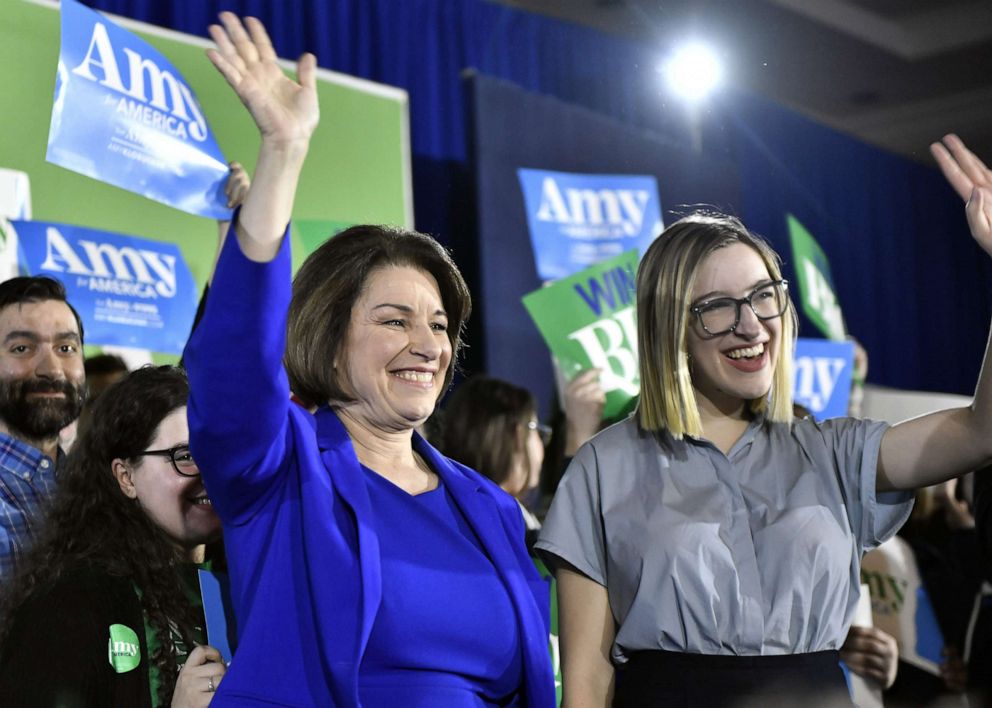 PHOTO: Democratic presidential candidate Sen. Amy Klobuchar and her daughter Abigail Klobuchar Bessler greet the crowd during a New Hampshire 2020 presidential primary night event in Concord, NH., Feb. 11, 2020.