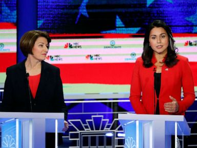 PHOTO: Amy Klobuchar and Tulsi Gabbard participate in the first Democratic primary debate hosted by NBC News at the Adrienne Arsht Center for the Performing Arts in Miami, Florida, June 26, 2019.
