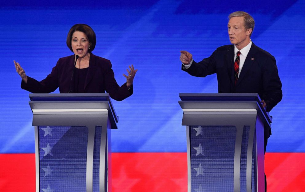PHOTO: Democratic presidential hopefuls Sen. Amy Klobuchar and billionaire activist Tom Steyer speak during the eighth Democratic primary debate of the 2020 presidential campaign season at St. Anselm College in Manchester, N.H. Feb. 7, 2020.