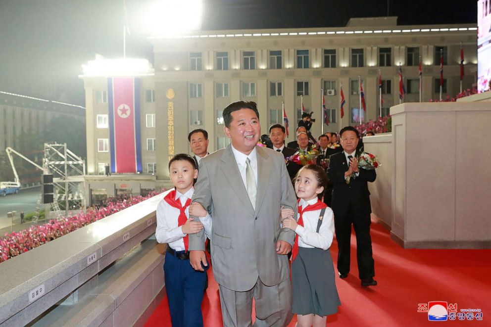 PHOTO: In this photo provided by the North Korean government, North Korean leader Kim Jong Un walks with children during a celebration of the nation's 73rd anniversary at Kim Il Sung Square in Pyongyang, North Korea, Sept. 9, 2021. 