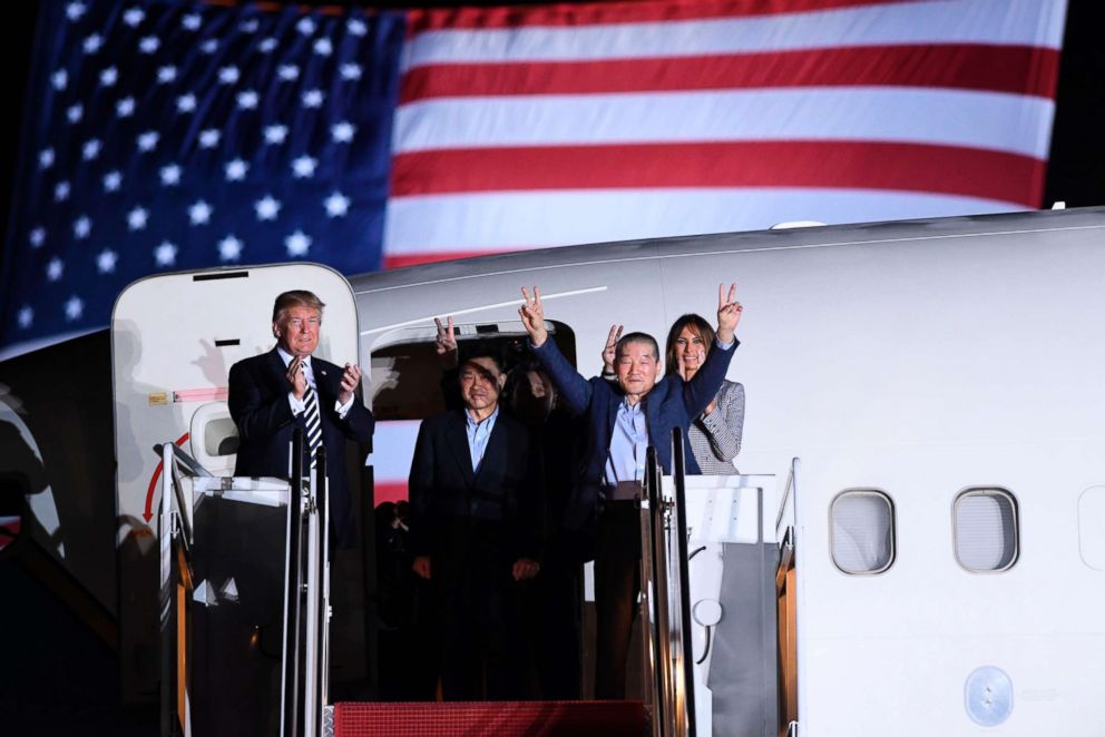 PHOTO: President Donald Trump applauds as US detainee Kim Dong-chul gestures upon his return with Kim Hak-song and Tony Kim after they were released by North Korea, at Joint Base Andrews in Maryland, May 10, 2018.