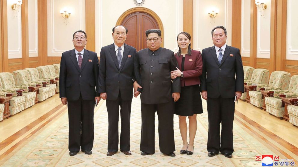 PHOTO: In a handout photograph released by the North Korean News Agency, North Korea's Kim Jong-un, center is shown with members of the high-level delegation, including his sister, Kim Yo-jong, who visited South Korea to attend the 2018 Winter Olympics.