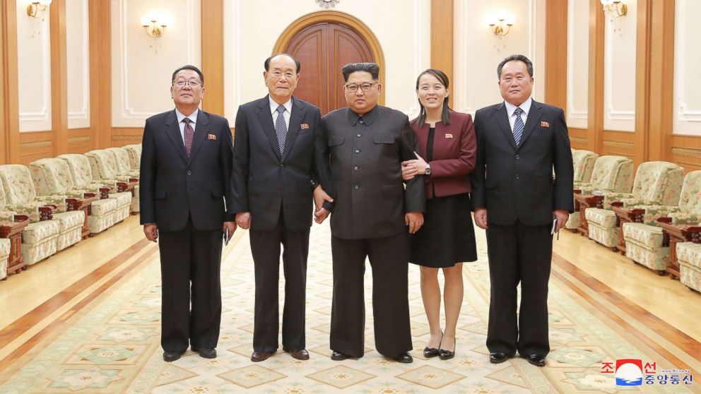 PHOTO: In a handout photograph released by the North Korean News Agency, North Korea's Kim Jong-un, center is shown with members of the high-level delegation, including his sister, Kim Yo-jong, who visited South Korea to attend  the 2018 Winter Olympics.