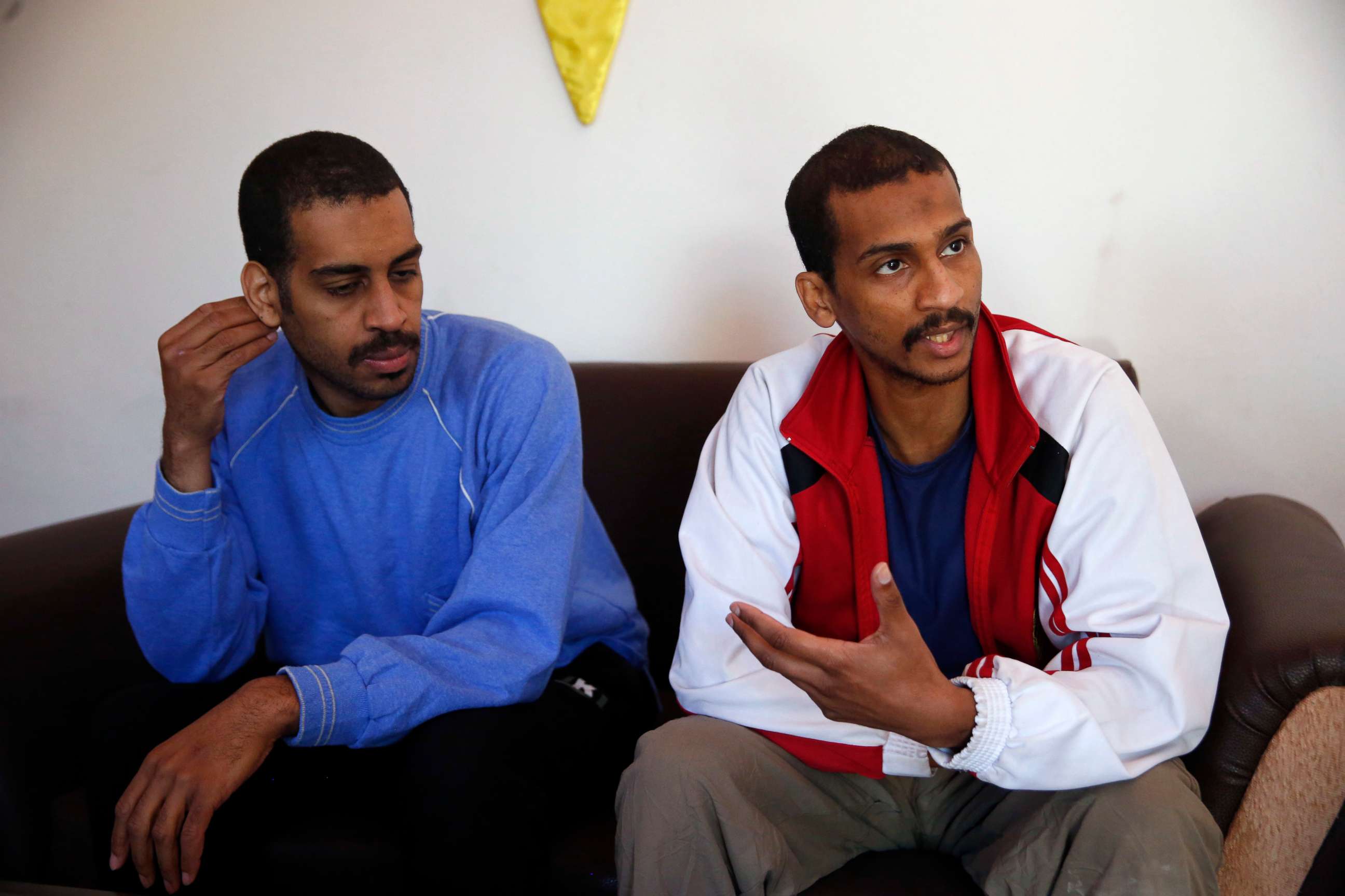 PHOTO: Alexanda Amon Kotey, left, and El Shafee Elsheikh speak during an interview with The Associated Press at a security center in Kobani, Syria, March 30, 2018.