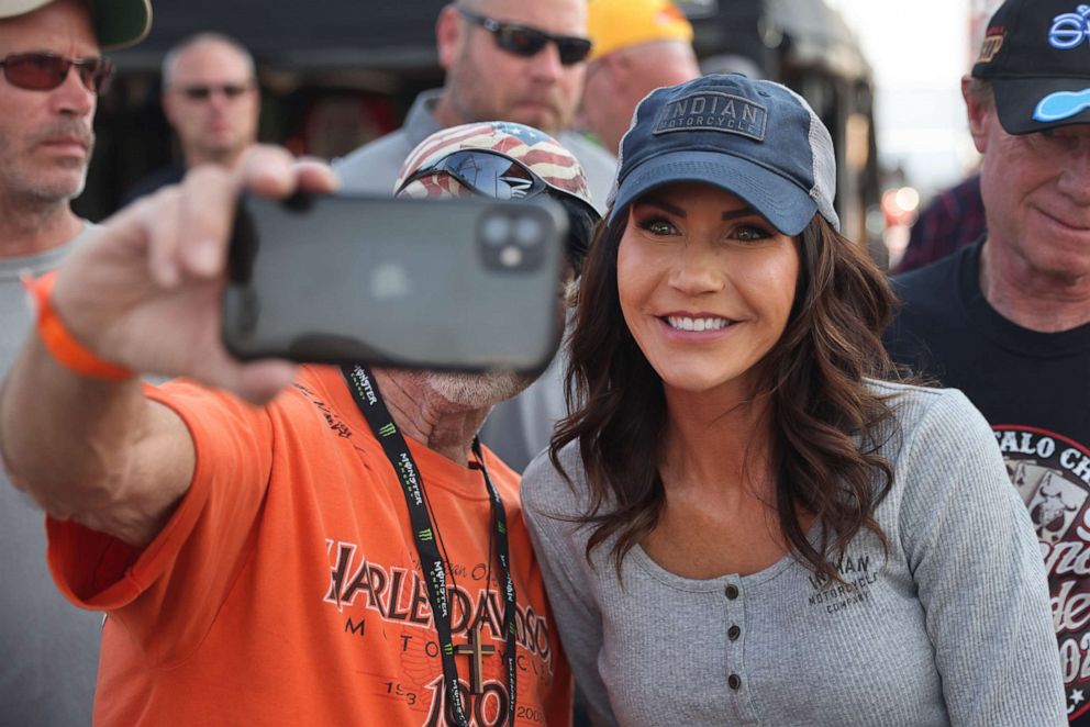PHOTO: Gov. Kristi Noem of South Dakota greets guests at the Sturgis Buffalo Chip campground after riding in the Legends Ride for charity on Aug. 9, 2021, near Sturgis, South Dakota.
