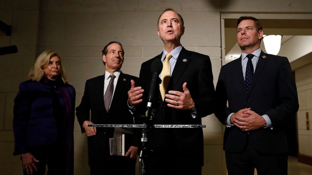 PHOTO: Rep. Adam Schiff, D-Calif., second from right, speaks with members of the media after former deputy national security adviser Charles Kupperman signaled that he would not appear as scheduled for a closed door meeting.