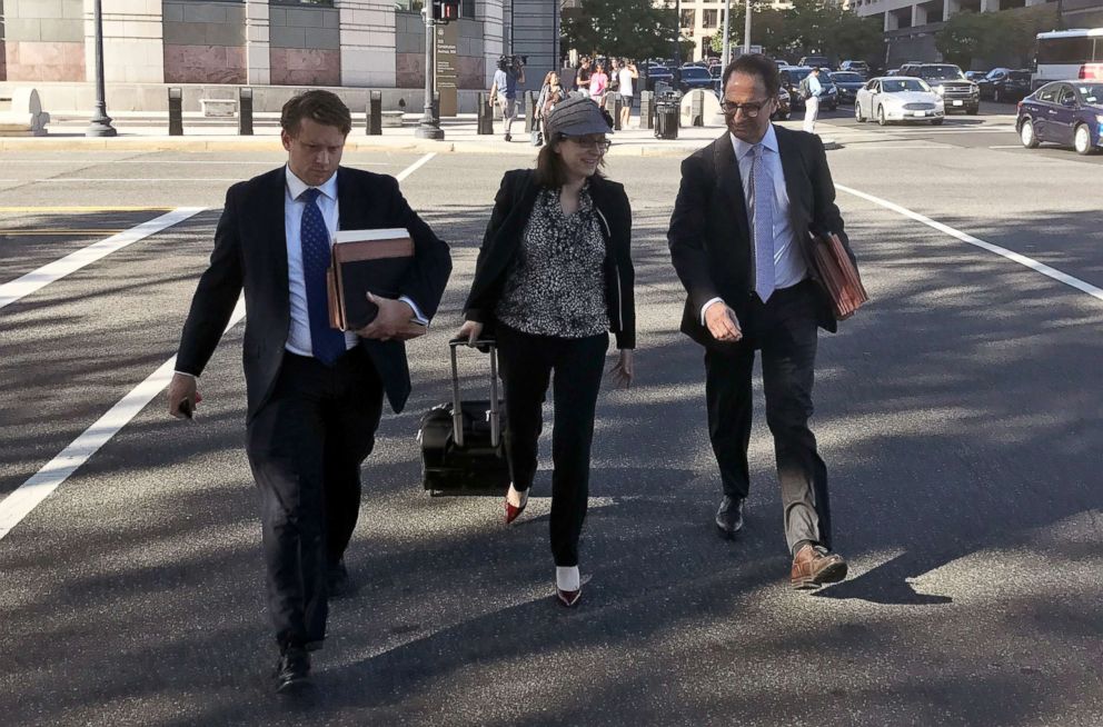 PHOTO: Kyle Freeny, center, walks with Andrew Weissman, right, as they leave court in Washington, Sept. 29, 2017.