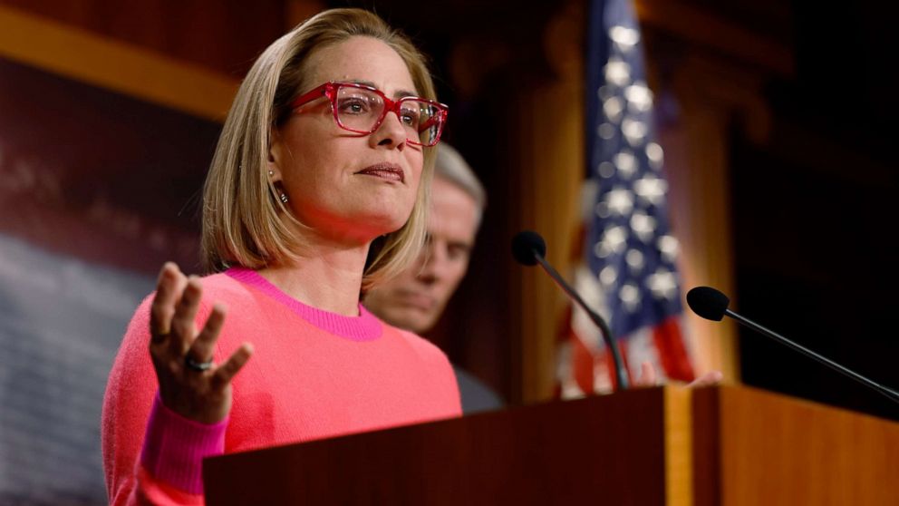 PHOTO: Sen. Kyrtsen Sinema (D-AZ) speaks at a news conference after the Senate passed the Marriage Equality Act at the Capitol Building on Nov. 29, 2022 in Washington, DC. 