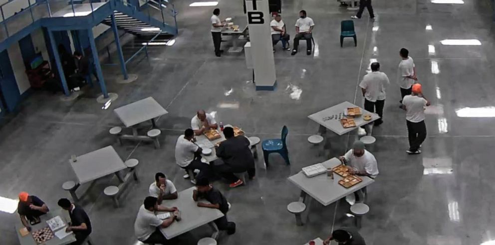 PHOTO: Detainees not wearing masks gathering in groups of two or three and not
practicing social distancing in their housing unit on July 1, 2020. 